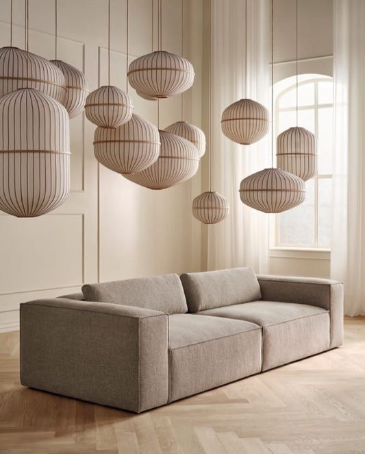 Canapé d’angle design avec accoudoirs capitonnés